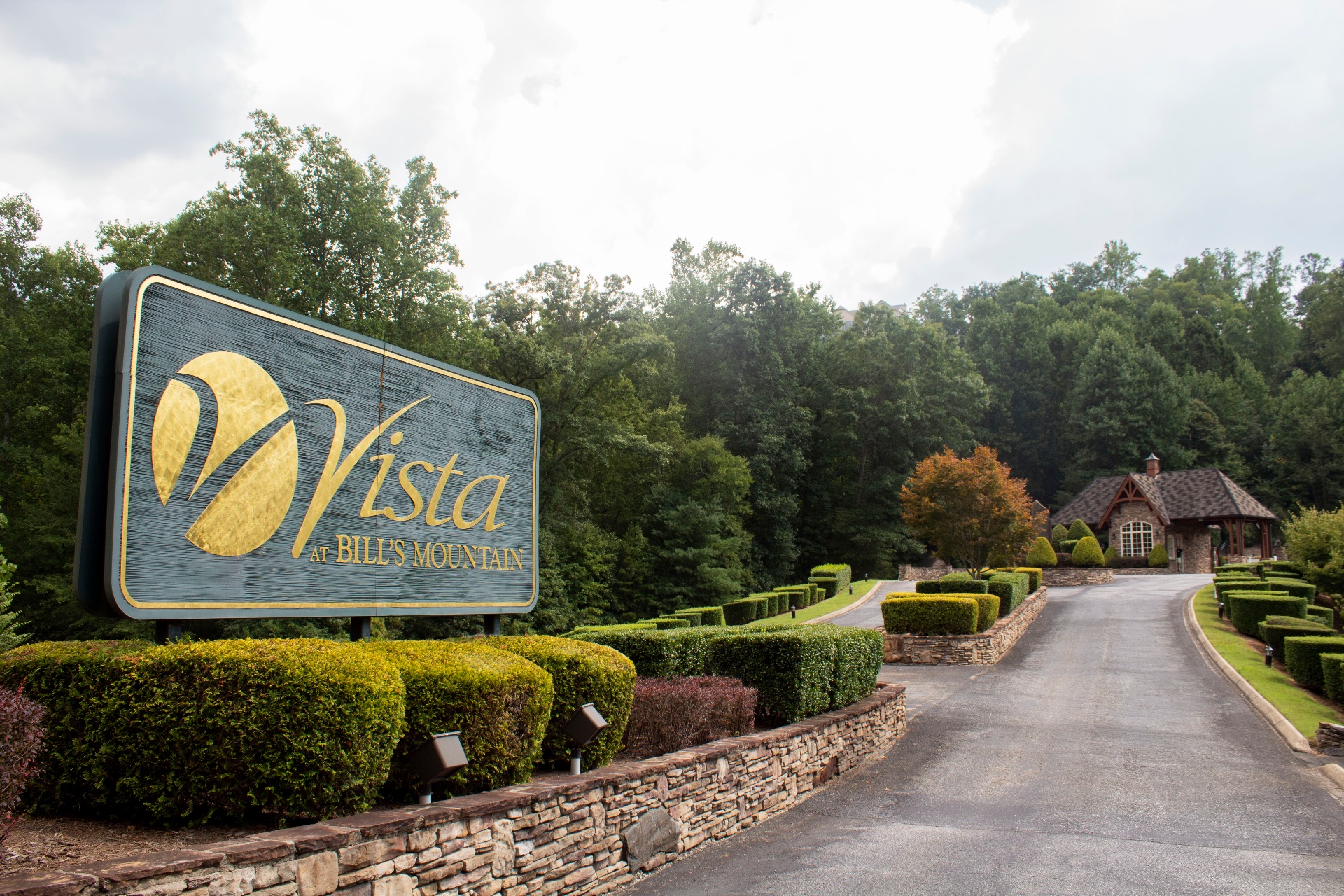 Vista Developers sign in front of a road that leads up into the Bill's Mountain Community in WNC.